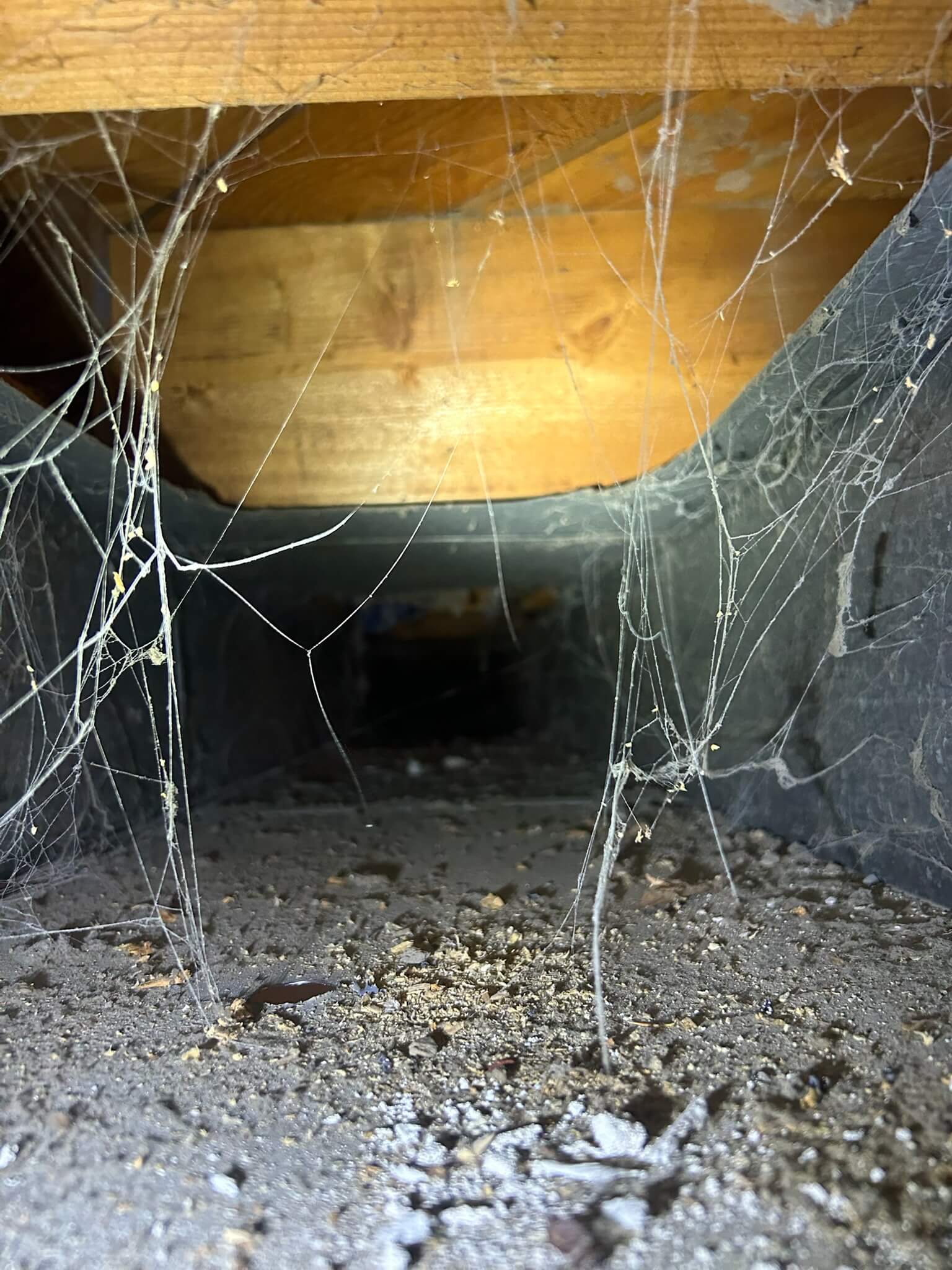 Air duct interior before cleaning, showing dust buildup