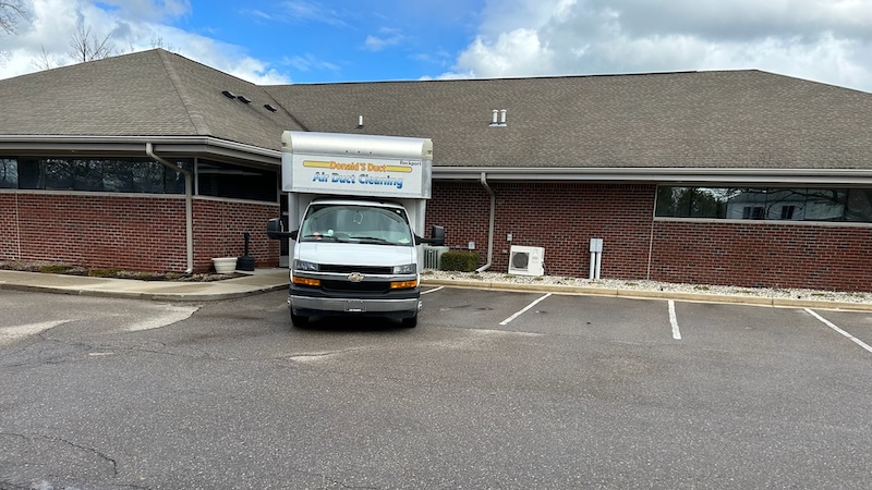 Air duct cleaning service van at a Sterling Heights home
